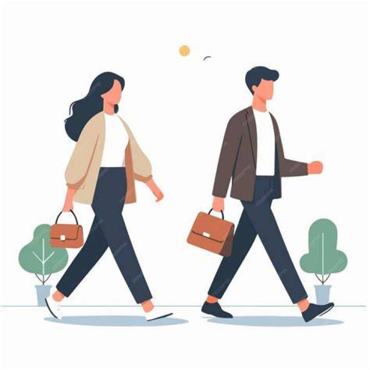 a man and woman walking through an airport