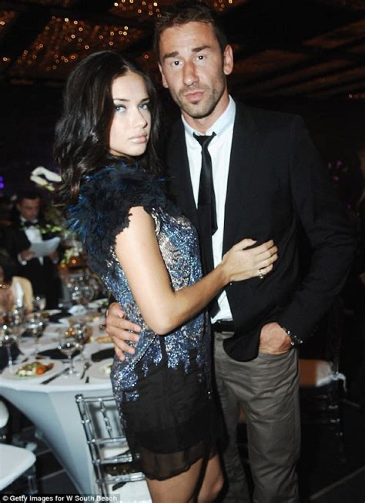 Adriana Lima puts split woes behind her...and dons furry waistcoat to