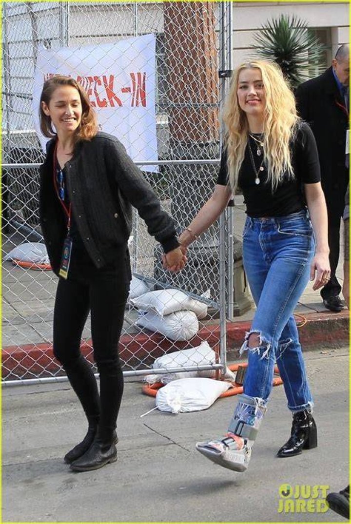 Amber Heard holds hands with girlfriend Biance Butti in LA Amber