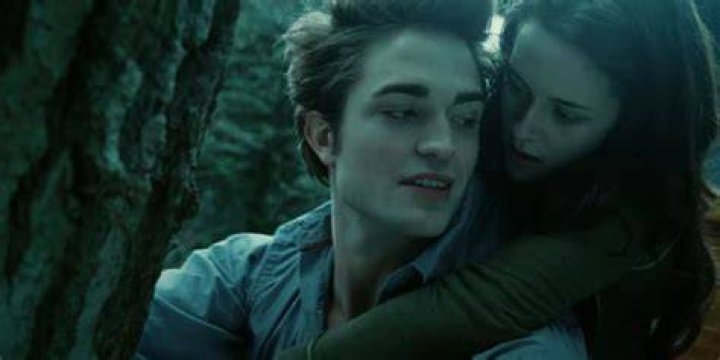 Bella holds onto edward in twilight