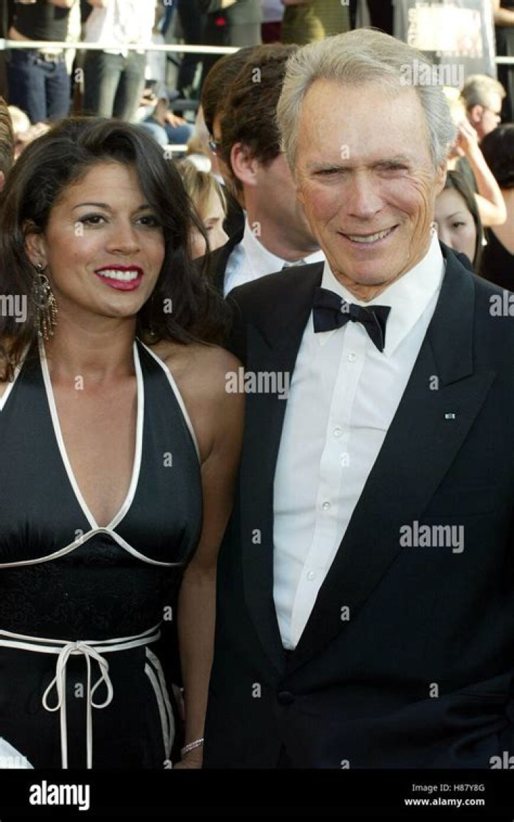 Clint Eastwood & Dina Ruiz Eastwood attend the 'Flags Of Our Fathers