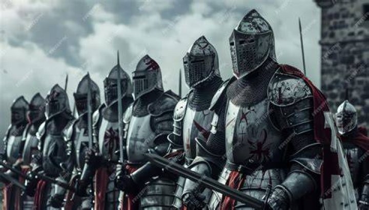 Death Knights standing together in a dark, stone room with their weapons and armor