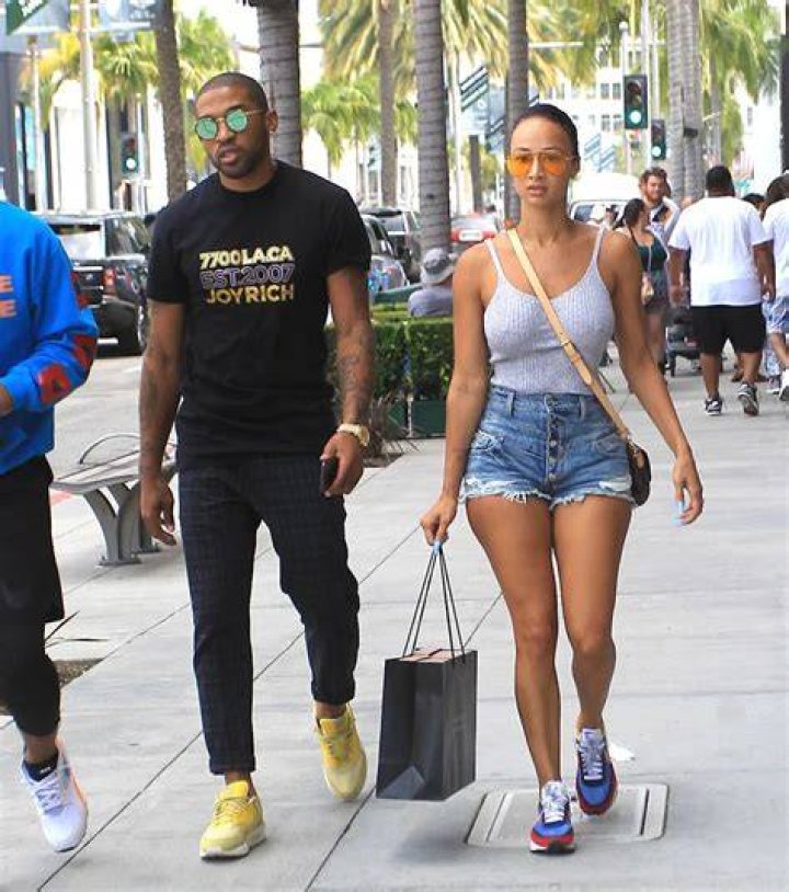 Draya Michele and fiancé Orlando Scandrick share a kiss at Miami Swim