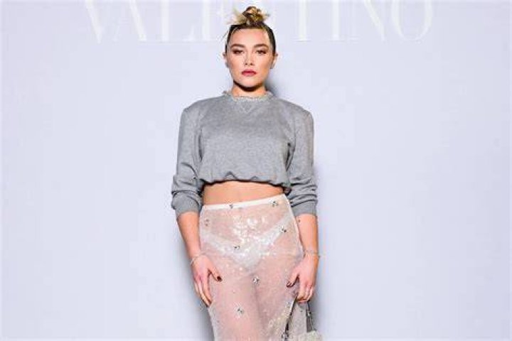 Florence Pugh wows in cheeky thighsplit midi dress in Paris with