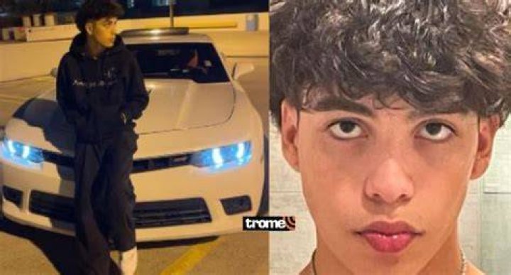 GabeNotBabe in front of his car
