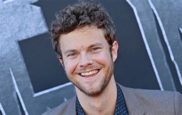 Jack Quaid packs on the PDA with girlfriend Claudia Doumit during RARE