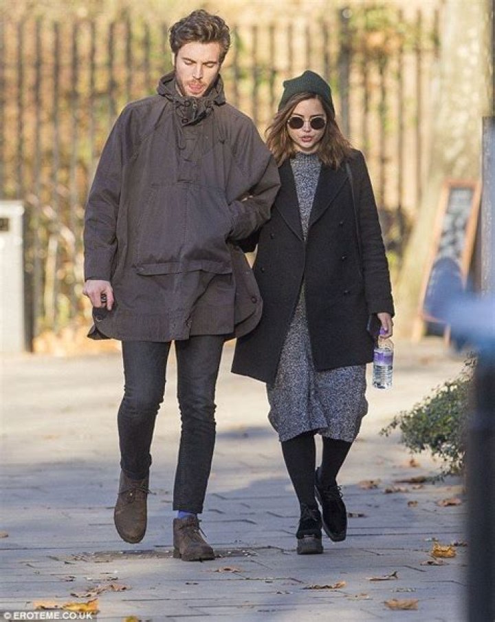 Jenna Coleman is pictured kissing boyfriend Tom Hughes for the first