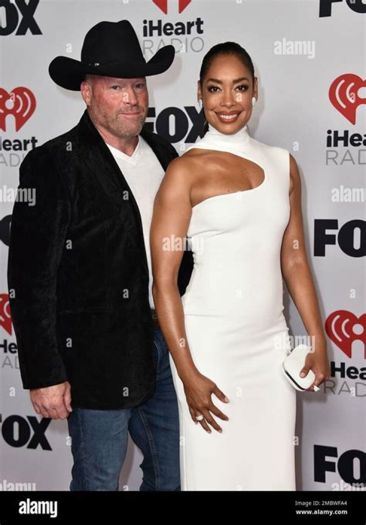 Kevin Wright, left, and Gina Torres arrive at the iHeartRadio Music