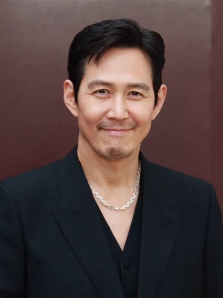Lee Jung Jae appears on the 'Emmys' red carpet handinhand with