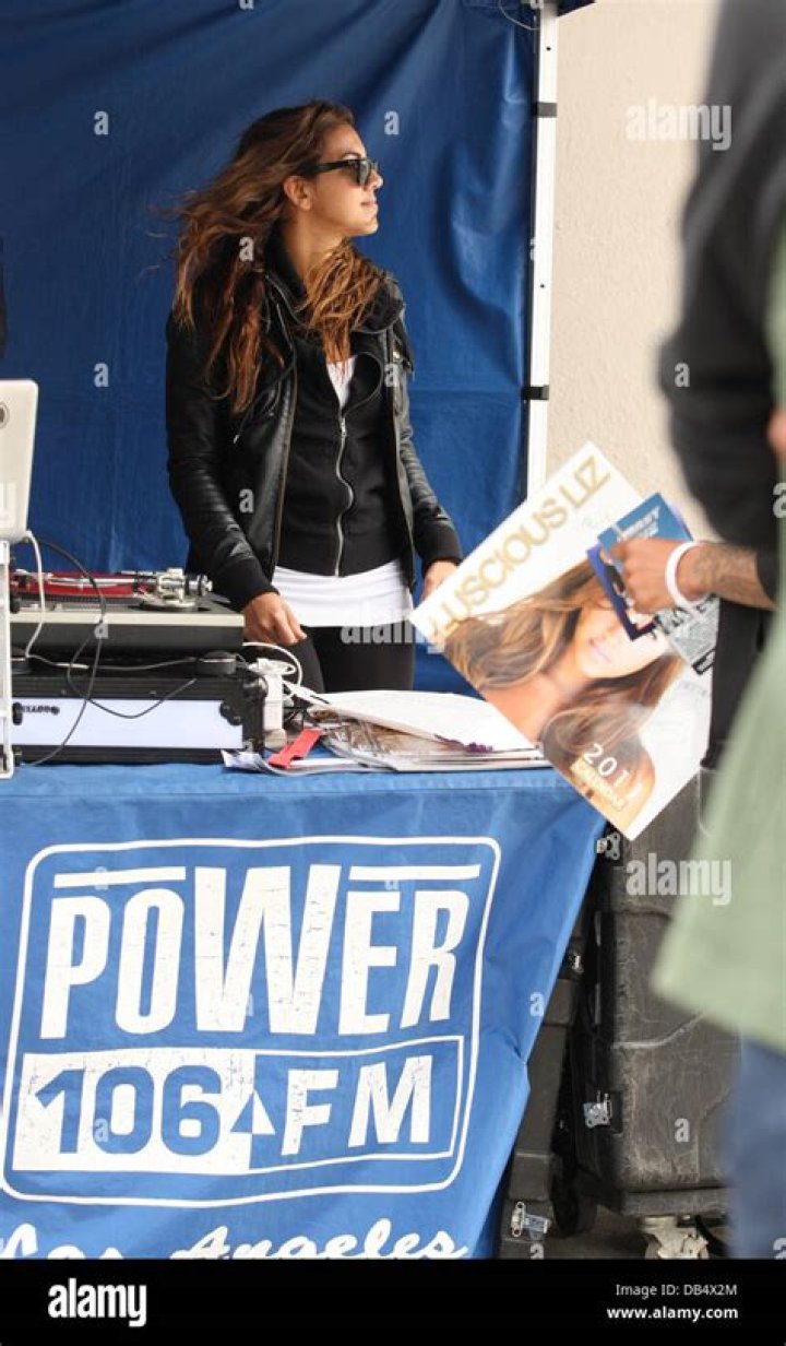 Liz Hernandez aka Luscious Liz broadcasting her radio show in front of