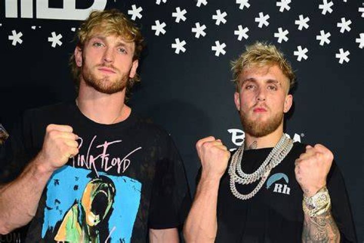 Logan Paul embraces Jake after beating Tyron Woodley