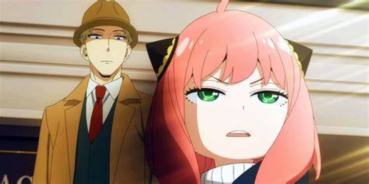 Loid holds Anya up joyfully in Spy x Family