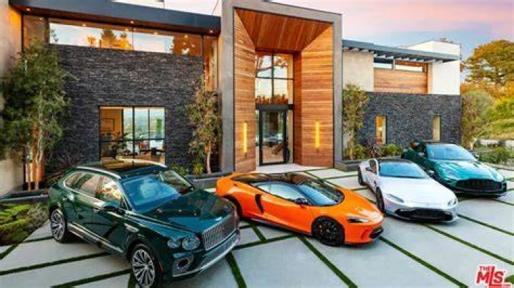 Mansion, House, Cars Prince Gozie Okeke has a house and drives nice cars.