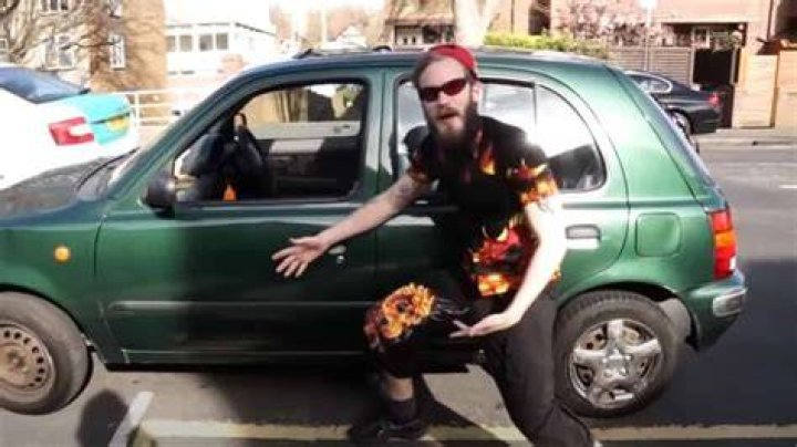 PewDiePie posing with his Nissan in 2016