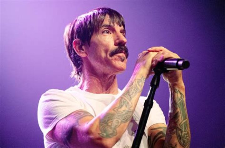 Red Hot Chili Peppers frontman Anthony Kiedis tenderly holds hands with