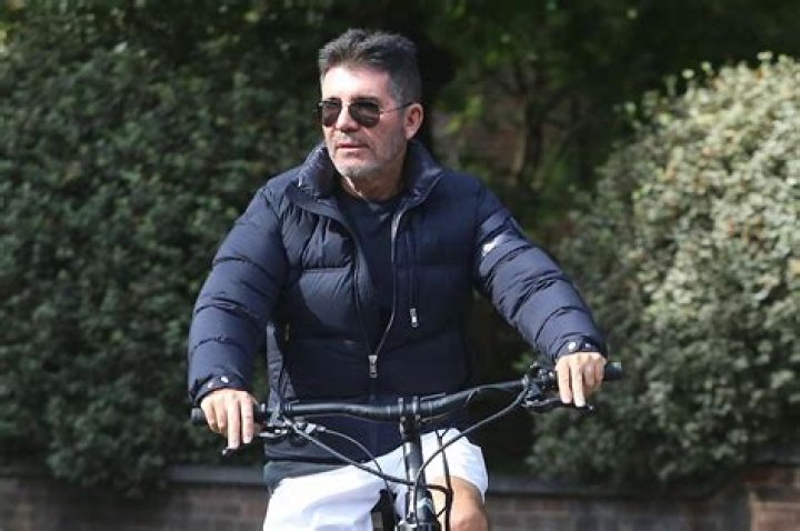 Simon Cowell still rides electric bike without helmet after accidents
