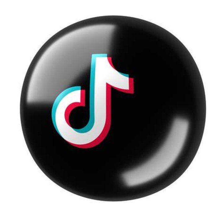 TikTok logo in front of an eclipse