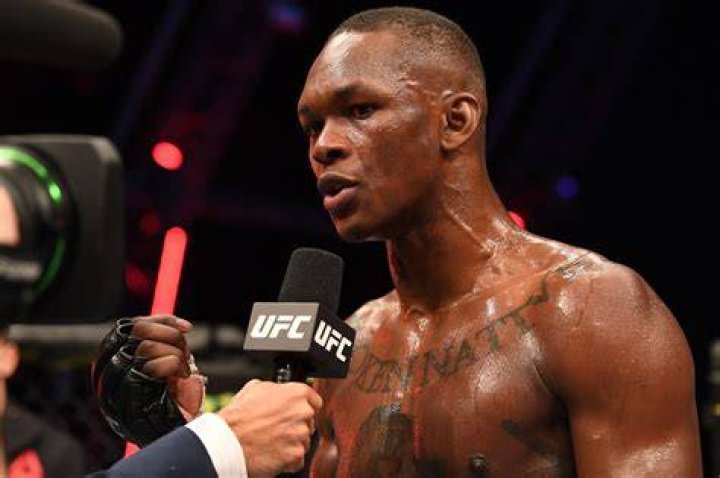 UFC Champion Israel Adesanya speaking with Andrew Schulz screenshot.
